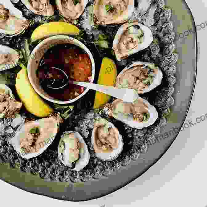 A Plate Of Freshly Shucked Oysters Served With A Mignonette Sauce And A Glass Of Champagne In The Background. All Time Best Dinners For Two