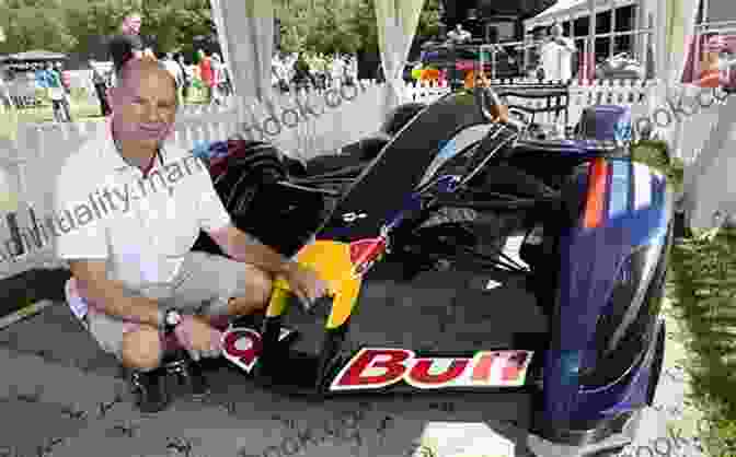 Adrian Newey, The Legendary Formula 1 Designer, Holding A Model Of The Red Bull RB16B How To Build A Car: The Autobiography Of The World S Greatest Formula 1 Designer